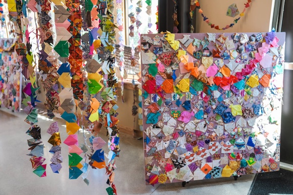 Pictured: Hundreds of colorful origami fish