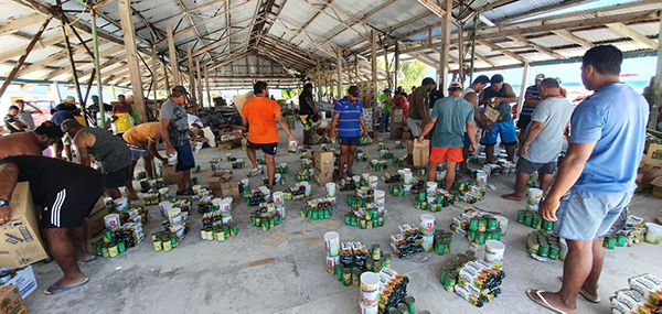 People organize bunches of food and cans