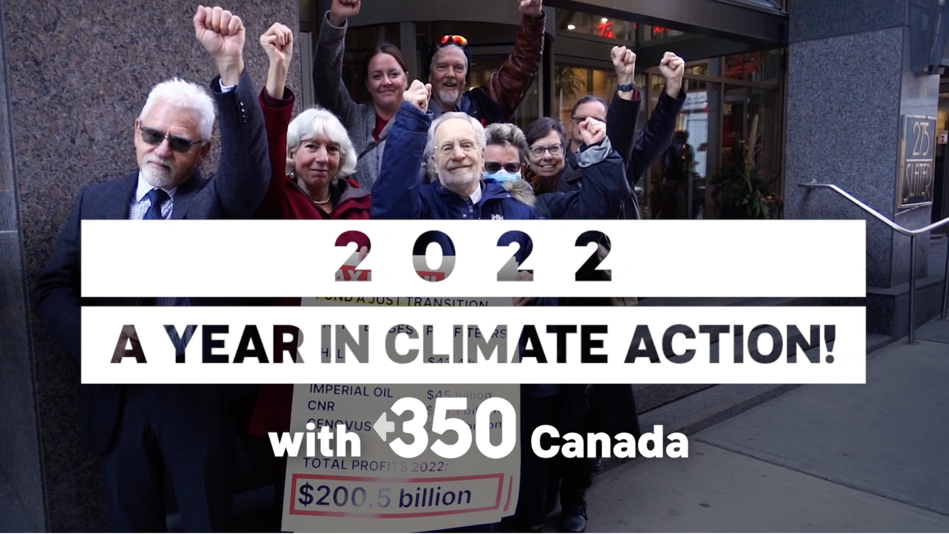 A clip from 350 Canada's 2022 recap video showing supporters raising their fists.